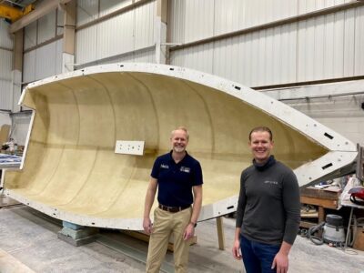 Hein Kuiper of Boats on Wheels and Tommi Buckley of Buckley Yacht Design in front of the mould of the latest BTC22 under construction